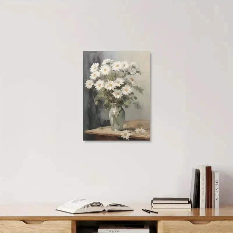 Framed artwork of a floral still life on a wall above a wooden shelf with books.