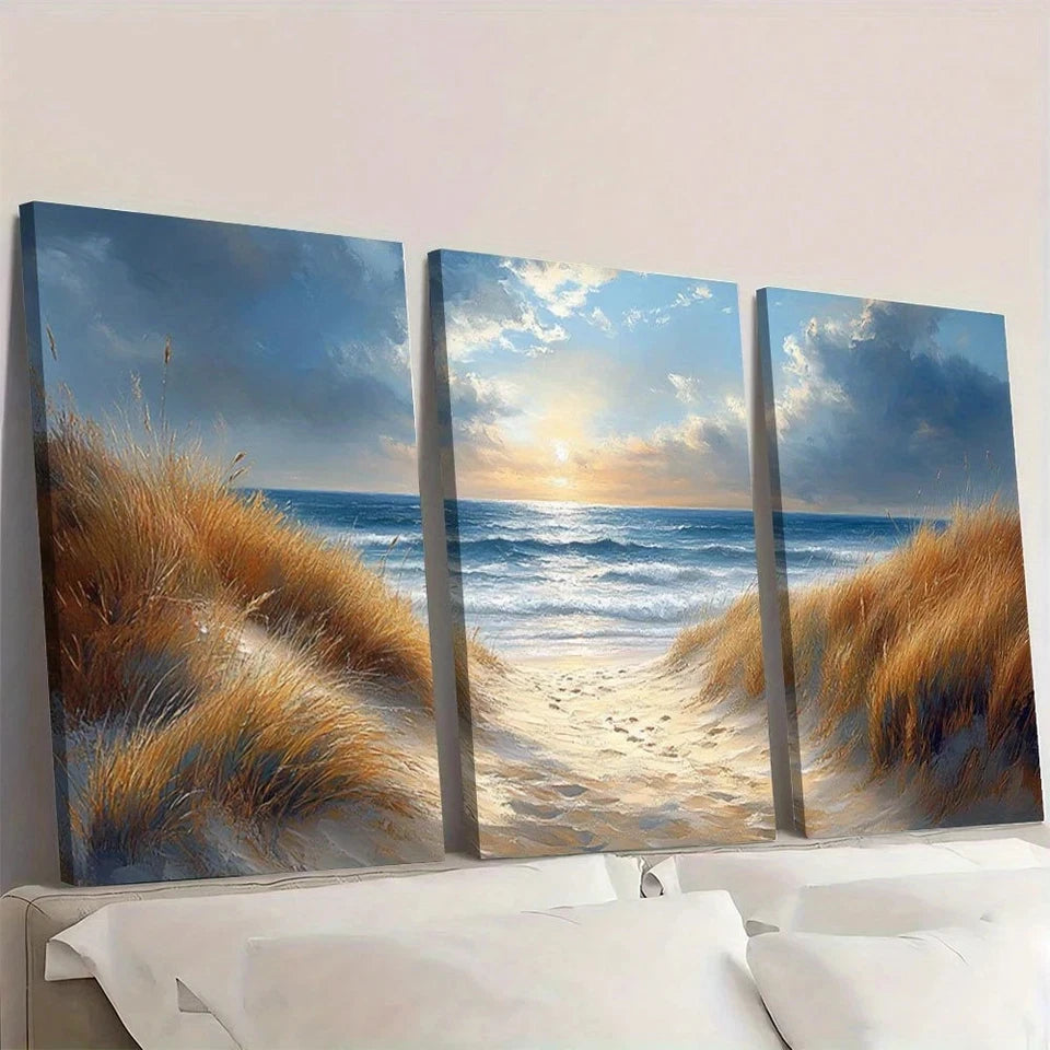 Three-panel canvas print of a beach scene with sunset and grasses.