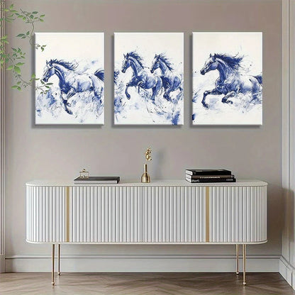 Three blue and white horse paintings above a decorative cabinet.