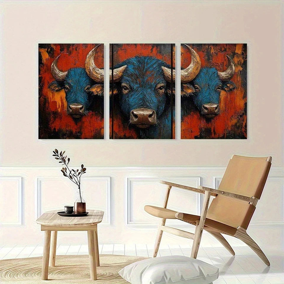 Three-panel painting of bulls on a wall above a wooden table and chair.