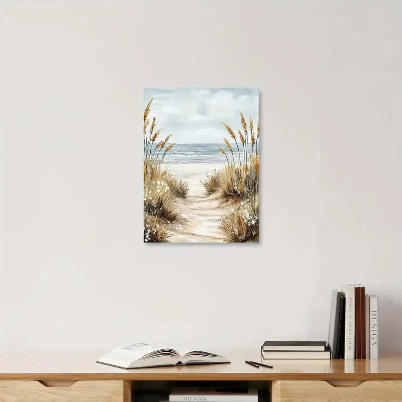 Beach-themed wall art above a wooden shelf with books and a pen.
