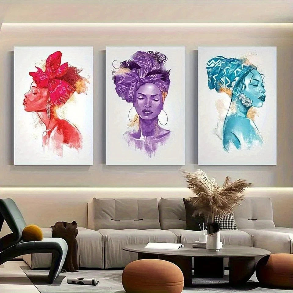 Three colorful wall art pieces of women with headwraps in a living room.
