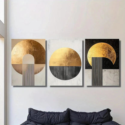 Three abstract wall art pieces with gold and black designs on a white wall above a sofa.