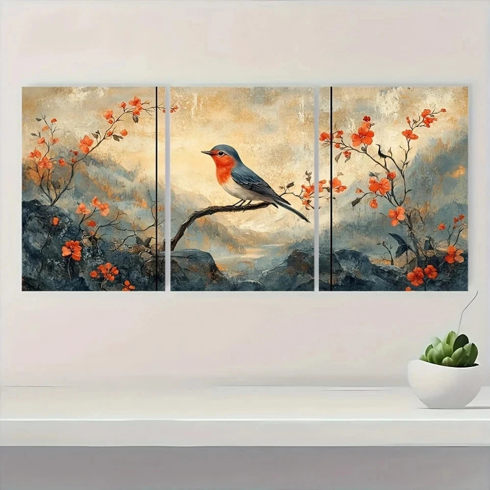 Triptych painting of a bird on a branch with flowers, displayed on a wall above a shelf with a plant.