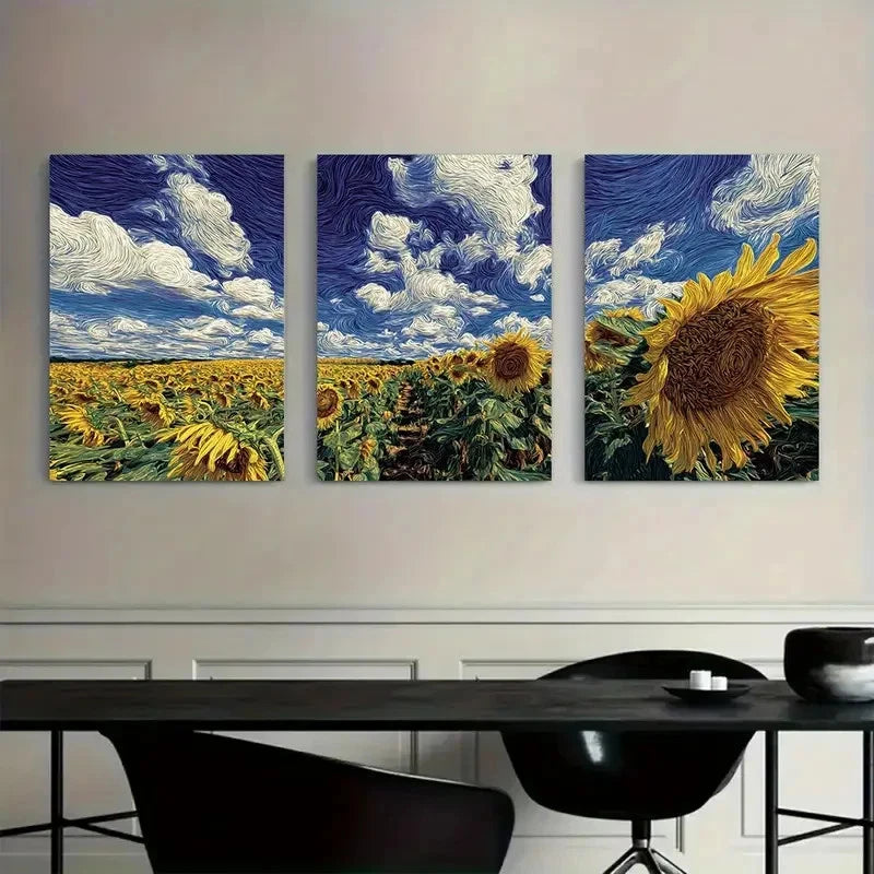 Three paintings of sunflower fields and a close-up of a sunflower on a wall above a modern black dining table.