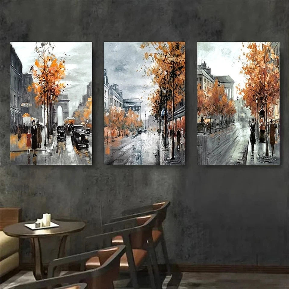 Three abstract art pieces on a wall with a cityscape theme, featuring trees and people.