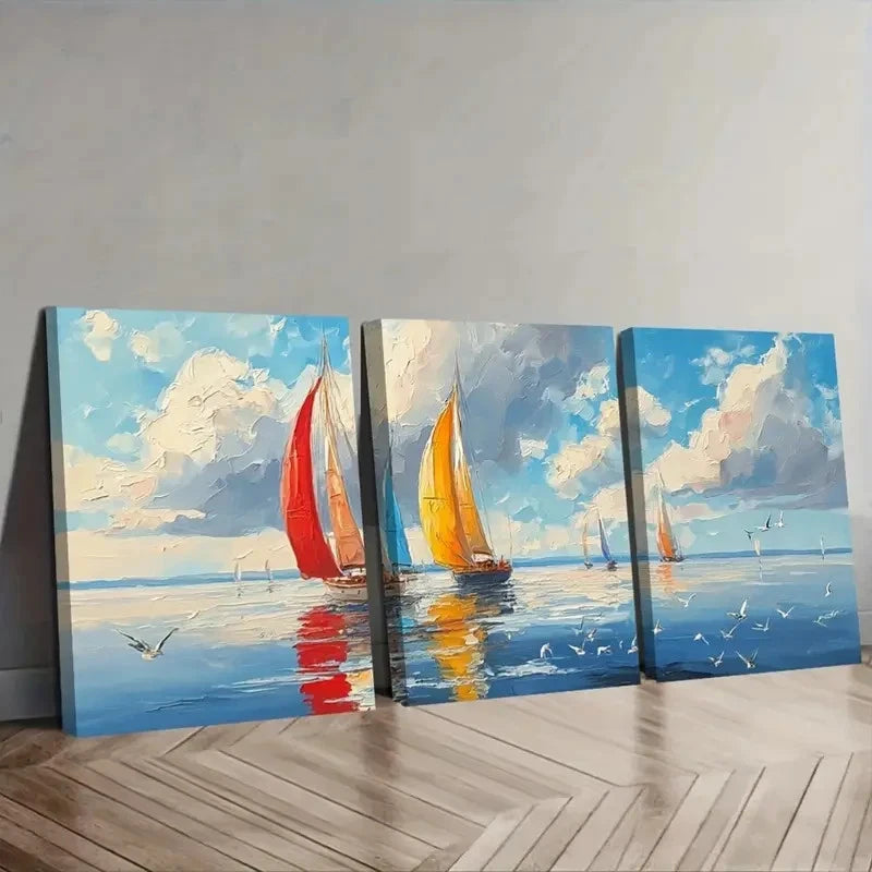 Three canvas paintings of sailboats on a wall