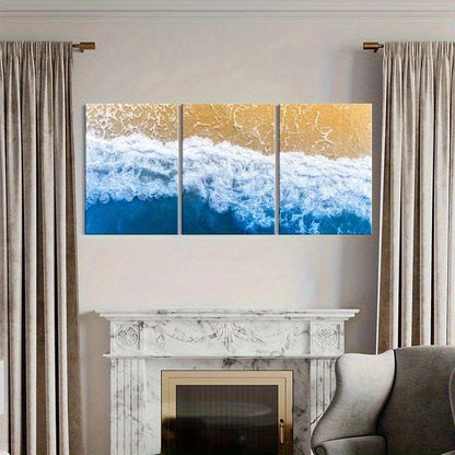Three-panel artwork of ocean waves above a fireplace in a living room.