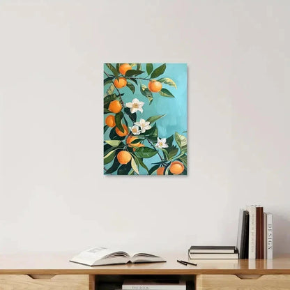 Framed artwork of oranges and flowers on a wall above a shelf with books and an open book.