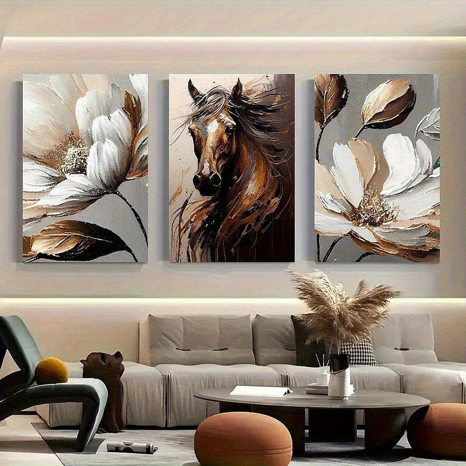 Three abstract art pieces of flowers and a horse on a wall above a living room.