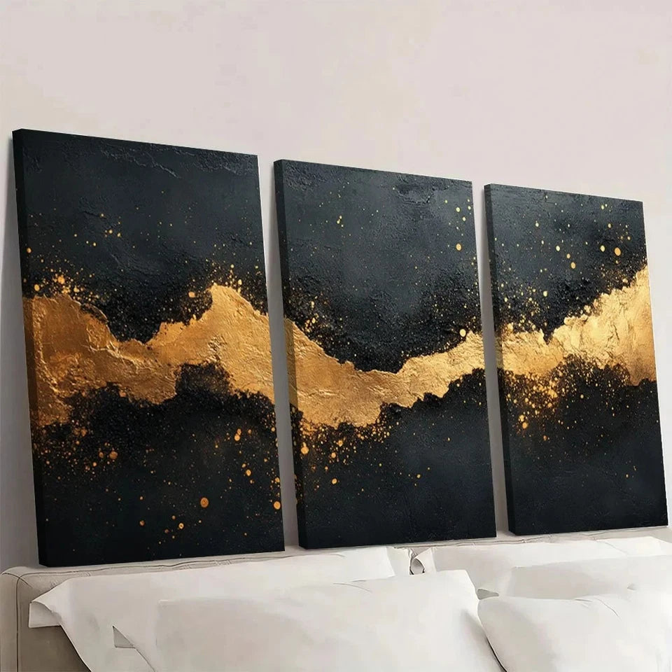Three black and gold abstract art pieces on a white wall.