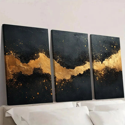 Three black and gold abstract art pieces on a white wall.