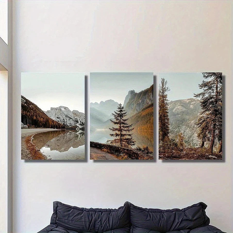 Three-panel wall art of a mountain landscape with trees and a lake.