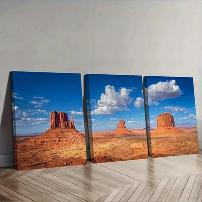 Triptych canvas print of a desert landscape with rock formations and blue sky.
